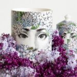 SCENTED CANDLES ORTENSIA. THIS CANDLE HAS THE FLORA FRAGRANCE WITH NOTES OF LILY OF THE VALLEY, JASMINE, TUBEROSE AND¬†SANDALWOOD, WHICH IS AVAILABLE IN A RANGE OF DIFFERENT DESIGNS FROM FORNASETTI