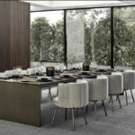 LINHA DINING TABLE by MARCIO KOGAN (STUDIO MK27), designed in 2020. In the more sculptural version, the frame designs a bridge, the top flush with the sides, whereas in the other tables the blade-like legs are set back from the surface.