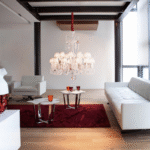 Z√âNITH FLOU, JE TE VOIS FLOU chandelier. The resplendent design, whimsically conceived of by the ever-inventive PHILIPPE STARCK mixes clear crystal, pink crystal and mist crystal alongside frosted ornaments. This particular color concept makes the Baccarat chandelier of appears ‚Äúunfocused‚Äù, evoking the effect of an out-of-focus camera lens, which in turn creates a stunning optical illusion. A romantic and poetic reinterpretation of Baccarat‚Äôs iconic Zenith chandelier, the ‚ÄúUnfocused‚Äù version also boasts a simplified silhouette. By suppressing most of the chains, the chandelier appears to possess a wonderful lightness. Also offered in black, the Unfocused Zenith chandelier is available by special order. Available in 2 Sizes and the number of lights ranges  from 6 to 24.