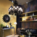 Crystal chandelier Z√âNITH NOIR - designer PHILIPPE STARCK. Maintaining the chandelier‚Äôs original structure and ornamentation, STARCK adds black shades lined with aluminum reflectors to magnify the effect of light on the black crystal (must be ordered separately). Baccarat‚Äôs signature red octagonal crystal is here linked to a spiked prism, specially designed by STARCK.