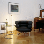 ADJUSTABLE Table E 1027 designed by EILEEN GRAY, 1927. This is the classic among classics. Its ingeniously proportioned, distinctive form has made this height-adjustable table one of the most popular design icons of the 20th century. It is named after the house E 1027 ‚ÄòMaison en bord de mer‚Äô that EILEEN GRAY built for herself and for her partner, JEAN BADOVICI. The code-name likewise comes from: E is for Eileen, 10 for Jean (J is the 10th letter of the alphabet), 2 for B(adovici) and 7 for G(ray).