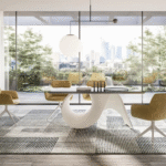 SEASHELL table  designed by GINO CAROLLO. The challenge posed by the SEASHELL table was to use a new material for the base: cement. People often associate cement with ‚Äúheaviness and solidity‚Äù both visually and physically, but we have re-imagined it to make it lighter and sturdy at the same time. We went for a soft sleek shape that takes its cues from the organic forms of nature, especially that of a shell with all its curves, ridges and furrows, whose structural solidity is belied by the incredibly fragility of the material it is made from. Thus, cement takes on a new aesthetic and functional meaning; the central base is an ideal solution and changes appearance according to the position you are looking from. Halfway between inspired creativity and functionality, this lightweight and sturdy table speaks to the soul. An ordinary everyday object has been transformed into a simple yet spectacular sculpture.