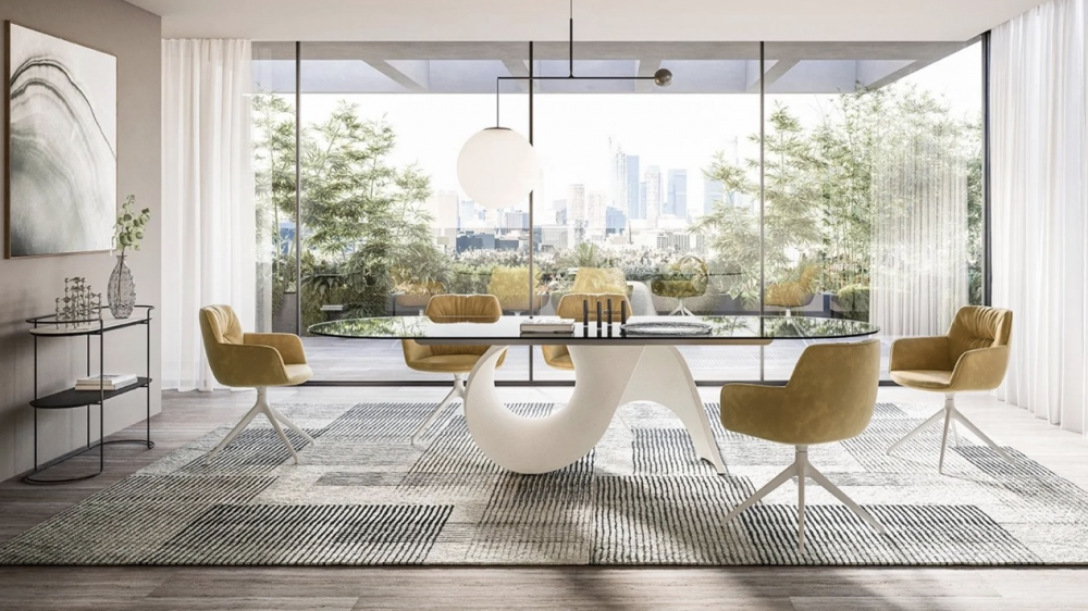 SEASHELL table  designed by GINO CAROLLO. The challenge posed by the SEASHELL table was to use a new material for the base: cement. People often associate cement with ‚Äúheaviness and solidity‚Äù both visually and physically, but we have re-imagined it to make it lighter and sturdy at the same time. We went for a soft sleek shape that takes its cues from the organic forms of nature, especially that of a shell with all its curves, ridges and furrows, whose structural solidity is belied by the incredibly fragility of the material it is made from. Thus, cement takes on a new aesthetic and functional meaning; the central base is an ideal solution and changes appearance according to the position you are looking from. Halfway between inspired creativity and functionality, this lightweight and sturdy table speaks to the soul. An ordinary everyday object has been transformed into a simple yet spectacular sculpture.