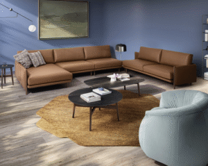 NIKI sofa designed by E-GGS. The design of the NIKI sofa is the result of a superimposition of planes. A light and linear top, together with the backrest and armrests, contains soft and ample cushions that give the sofa a comfortable but rigorous look. The detail of the wooden feet that makes it a unique body with the armrest, characterizes it and softens the lines. Also available a comfortable corner coffee table for the most elaborate compositions.