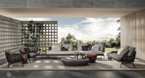 BELT CORD OUTDOOR by RODOLFO DORDONI, designed in 2022.The enveloping and comfortable body of the BELT seats designed for indoor use in 2021 also shapes the outdoor version. The band which, in the original design, outlines the silhouette of the volume recalling the shape of a belt, in its outdoor version becomes a corded contour in the colours Sand and Dark Brown, covering the shiny Bronze metal frame.