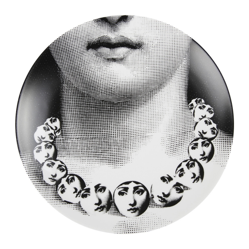 TEMA E VARIAZIONI WALL PLATE - NO. 107. THIS TEMA E VARIAZIONI WALL PLATE IS A TRULY UNIQUE PIECE OF ART FROM THE WORLD FAMOUS FORNASETTI BRAND. BEAUTIFULLY CRAFTED FROM PORCELAIN IT DEPICTS THE FACE OF OPERA SINGER LINA CAVALIERI DUPLICATED ONTO A CIRCULAR NECKLACE WORN BY HERSELF. CLASSICALLY INFLUENCED YET CONTEMPORARY IN STYLE, IT IS A STUNNING EXAMPLE OF THE DESIGNER‚ÄôS ICONIC STYLE & IT MAKES A FABULOUS GIFT IDEA FOR ANY OCCASION. DIAMETER:26CM