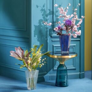 EYE VASE RECTANGULAR L. The wavy design of the crystal EYE vase comes from an extraordinary technique: exterior horizontal cuts and interior vertical cuts combine to produce a magic visual effect.With bevel cuts conjuring perpetual movement, the EYE vase is a spiral of light. The EYE vase fabrication produces a multitude of shades and shapes leaving scope for an infinite number of compositions for every taste and in every color.