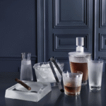 WINGEN crystal collection designed by REN√â LALIQUE. The ‚ÄúWINGEN‚Äù barware service is named after the village in Alsace where the Lalique Manufacture has been perpetuating its exceptional know-how. REN√â LALIQUE had already designed a stemware service with the same name in the 1920‚Äô, with a similar pattern. Displayed in a rhythmic rigor, the graphic lines in satin-finished crystal - emblematic of Lalique ‚Äì exhibit a timeless elegance.