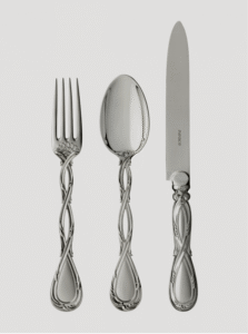 ROYAL cutlery collection. Louis-Victor Puiforcat, who transformed the simple family cutlery shop into a renowned silversmithing workshop at the end of the 19th century, drew his inspiration from the masterpieces of past craftsmen, which he revived. Thus, the design of the ROYAL line of cutlery had been conceived by  18th century silversmith, Nicolas Cornu. Its nobility lies in the refinement of its curved sterling silver handle, enhanced by an elegant interlacing of rocaille branches. The set‚Äôs sophistication demands the perfect mastery of traditional craftsmanship, including the delicate lime finish. The collection, also available upon request in gold immersion finish, includes a wide selection of cutlery and specialty accessories (serving pieces and oyster, snail and lobster forks, etc.)