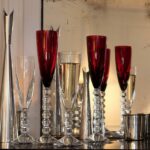 Sleek and modern, the VEGA champagne flute collection was created for Baccarat by design duo SAVINEL & ROSE. The pure and clean bowl contrasts with an angular and tactile stem. The result of this union is a beautiful glass that is as nice to hold as it is to look at.