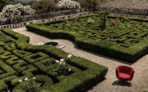 VERMELHA armchair BY CAMPANA BROTHERS. VERMELHA armchair is the main character at Villa Corsini at Mezzomonte, Florence, in a perfect example of Italian-style garden.