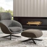 RUSSELL swivel berg√®re and cross base footstool by RODOLFO DORDONI