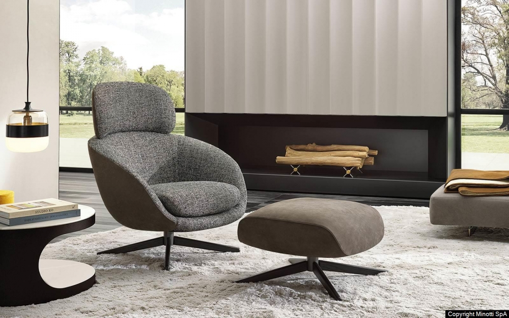 RUSSELL swivel berg√®re and cross base footstool by RODOLFO DORDONI