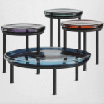 SODA coffee table designed by YIANNIS CHIKAS. SODA was born upside-down, with a puff of air. It weighs 20 kilos, and it is blown, drawn out and shaped by three master glassmakers. The result is a single volume of glass with three large petals forming the stem.