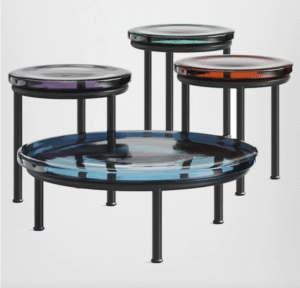 SODA coffee table designed by YIANNIS CHIKAS. SODA was born upside-down, with a puff of air. It weighs 20 kilos, and it is blown, drawn out and shaped by three master glassmakers. The result is a single volume of glass with three large petals forming the stem.