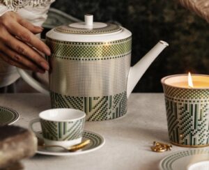 AUGUSTA collection.Featuring a captivating mosaic of gold, soft green, and emerald green, this collection of fine porcelain dinnerware pays homage to classical rigor with simplified motifs influenced by cubist geometry. While the AUGUSTA pieces are entirely functional as modern tableware, they also serve as decorative objects that capture the spirit of the Empire period. Collectors and enthusiasts of Napoleonic culture appreciate the collection for its ability to translate the aesthetic ideals of the early 19th century into timeless, elegant porcelain suitable for today’s interiors. In this way, the BERNARDAUD AUGUSTA collection stands not only as an example of excellent Limoges workmanship but also as a subtle homage to the artistic legacy of Napoleon’s empire.