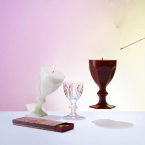 HARCOURT GLASS CANDLE.Inspired by BACCARAT'S most iconic creation, the HARCOURT GLASS CANDLE is a sculptural candle reinventing, entirely in wax, the original HARCOURT GLASS, which was first created in 1841. Known as the glass of princes and greats, it was commissioned by Emperor Napoleon III and has since adorned the world's most prestigious tables. Recognizable by its unique silhouette, six facets, and hexagonal base, it has been reinterpreted by some of the greatest designers. Available in a palette of bright, elegant colors, the collection captures the very essence of HARCOURT: a symbol of joie de vivre, boldness, and passion, remaining true to its history while always astonishing.